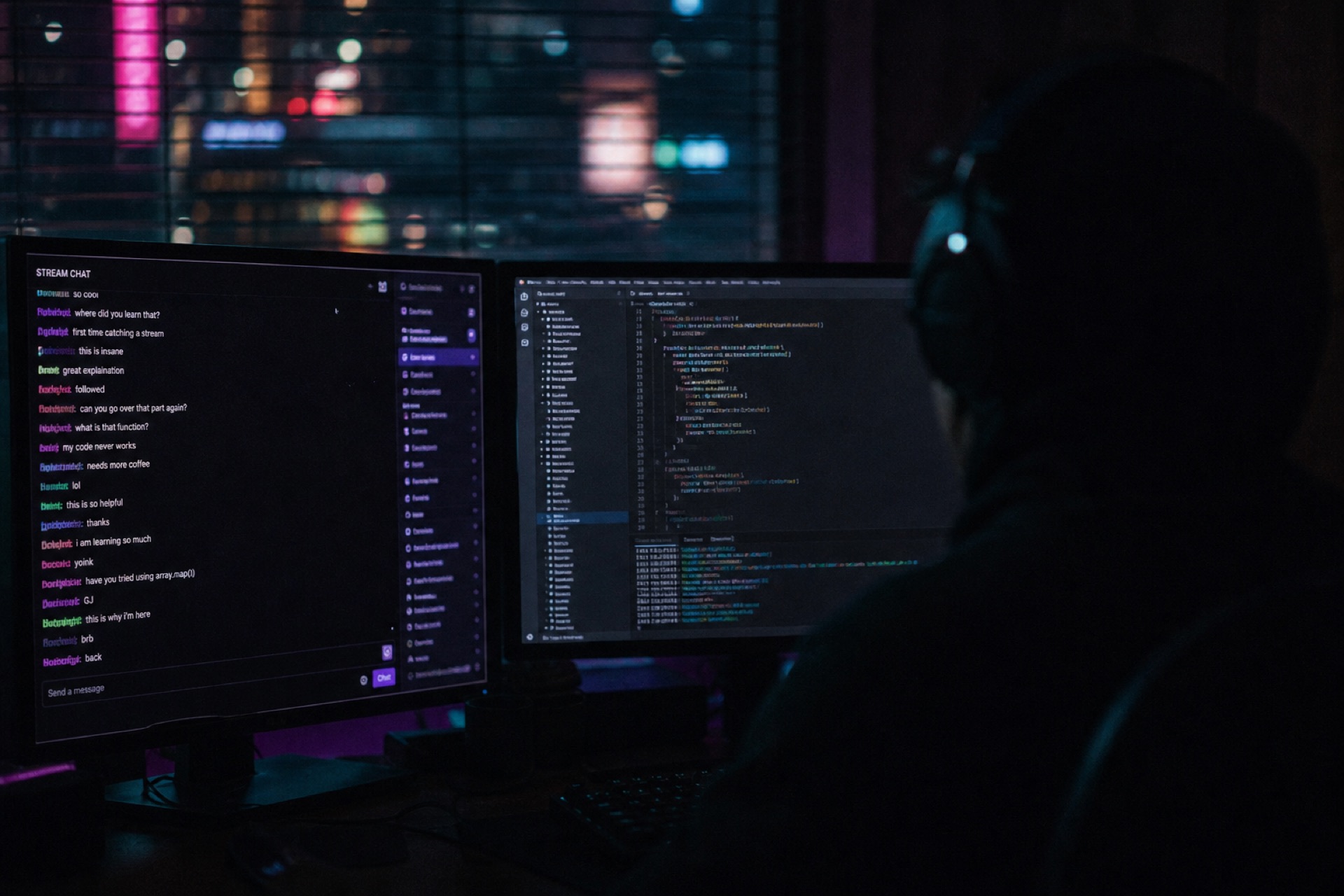 A live coding stream with chat on the second screen.